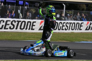 James Wharton applies the #1 to his kart after this afternoon's final